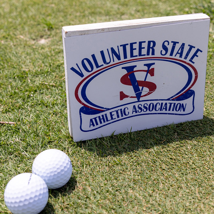 Volunteer State Athletic Association sign next to two golf balls