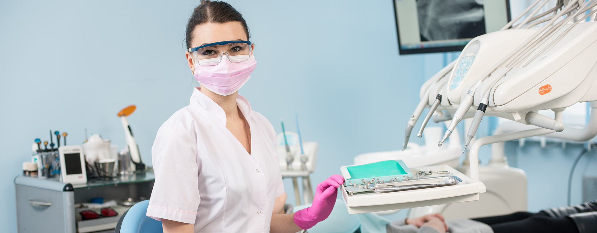 a female dental assistant prepping her workstation