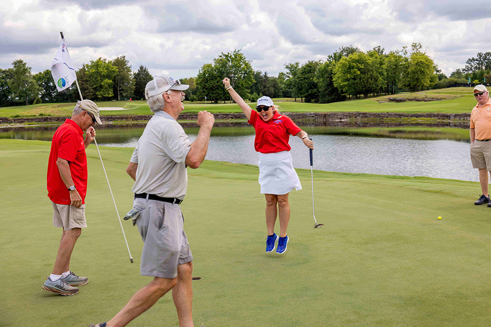 Dr. Tostenson celebrating a great putt