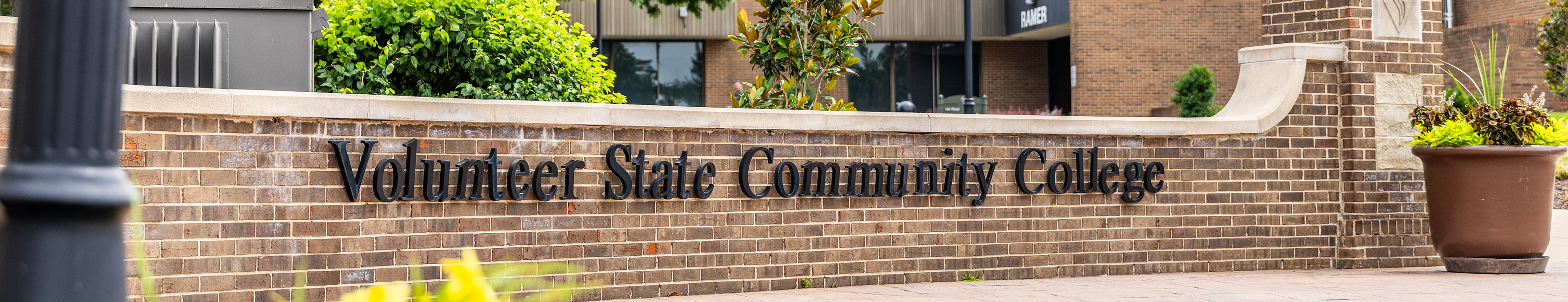 the Volunteer State Community College sign on a brick wall near the front of the Gallatin Campus