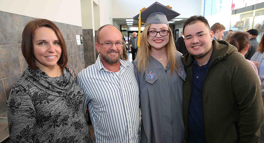 Graduate Meaghan Brewington of Westmoreland was joined by well-wishers Jennifer Copeland, Bernie Copeland, and Joseph Pinchevsky.