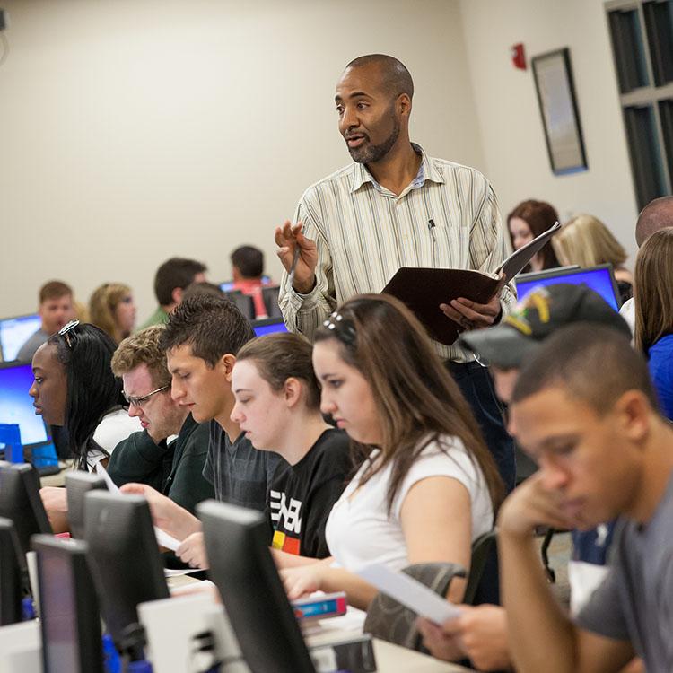 staff helping students register